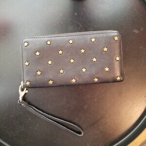 Fossil wristlet. Dark navy blue leather with brass stars.